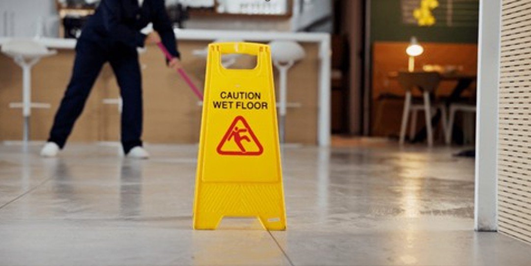 a wet floor sign. roof leak